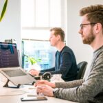 IT professional reviewing a backup schedule on a laptop