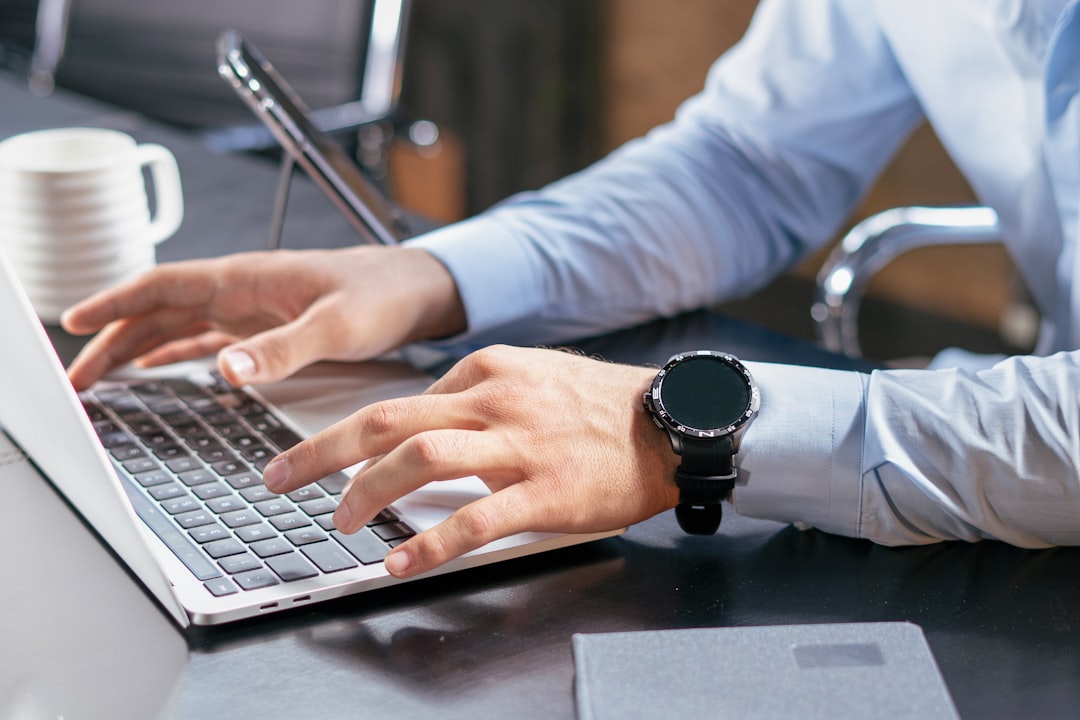 IT admin reviewing an update policy on a laptop screen