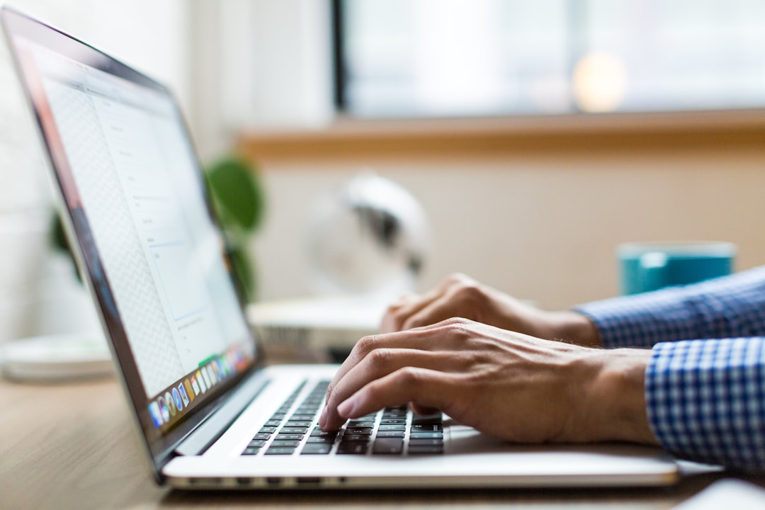 Marketer typing subject lines on a laptop before sending a campaign