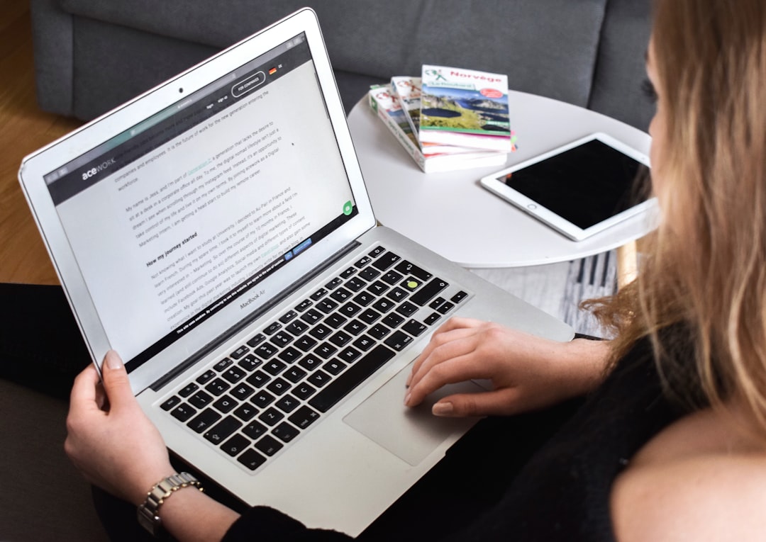 Small business owner comparing page builders on a laptop screen