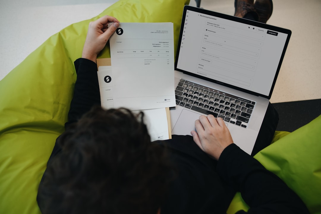 Freelancer calculating service pricing on a laptop