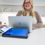 Small business owner reviewing least privilege access settings on a laptop