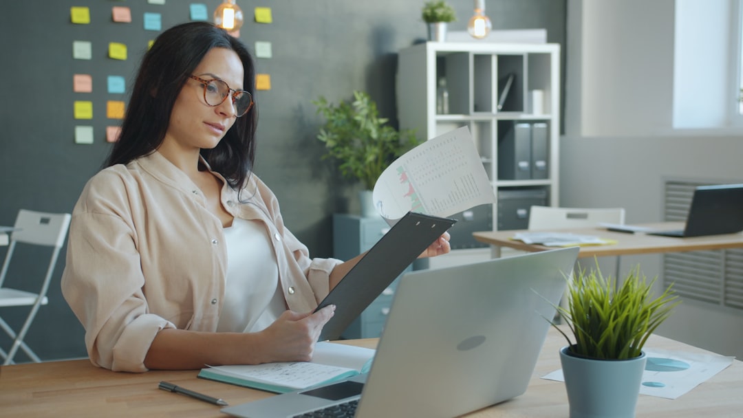 Small business owner checking egress fees on a cloud hosting invoice