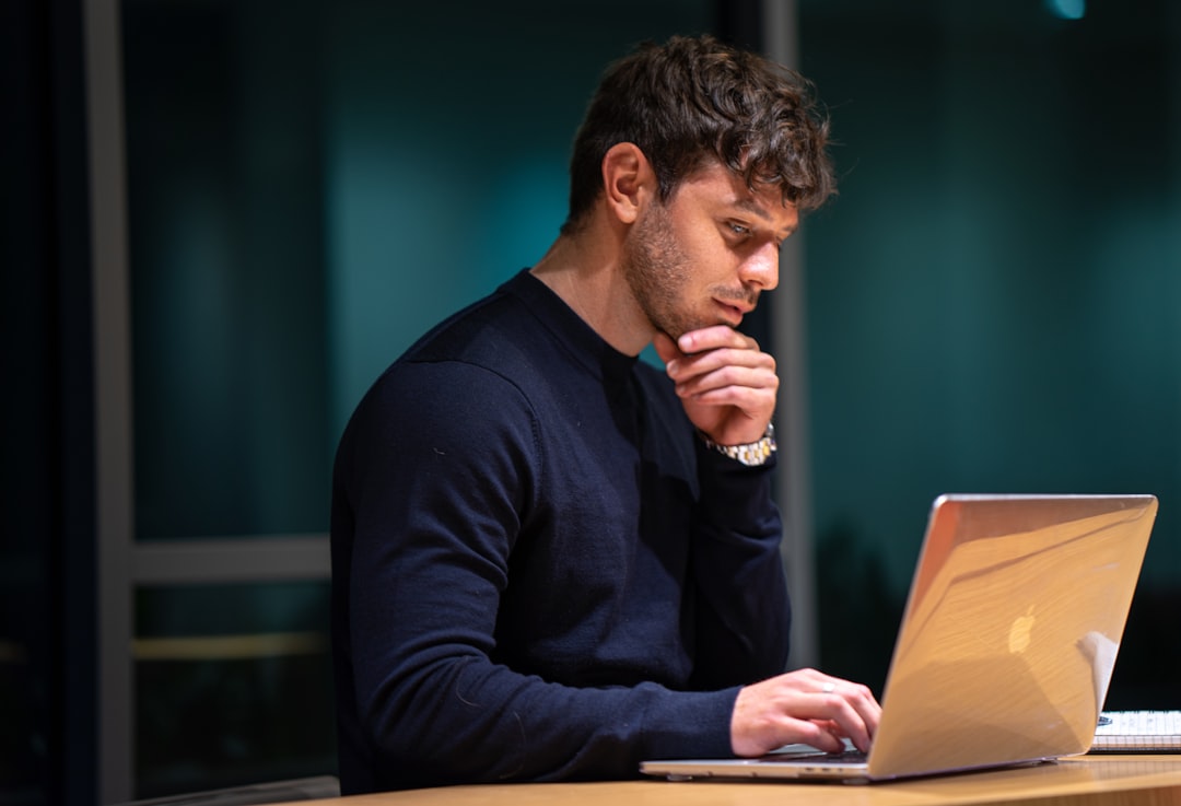 Product manager checking prompt engineering results on a laptop