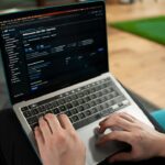 Web administrator checking DNS propagation status on a laptop